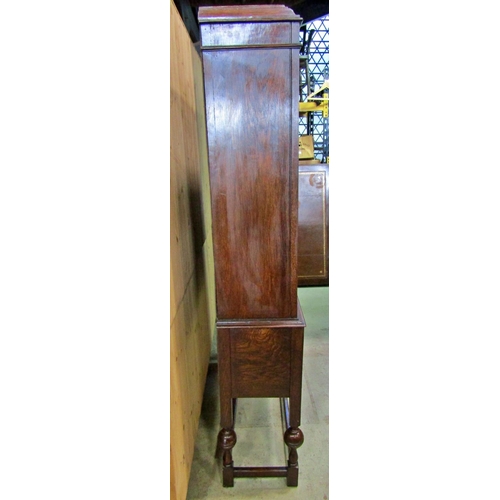 2206 - An Edwardian oak display cabinet with leaded astragal glazed panelled doors over two frieze drawers ... 