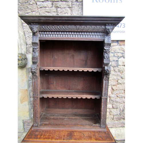 2207 - A mid 19th century continental pier cabinet the lower section enclosed by carved and panelled door w... 