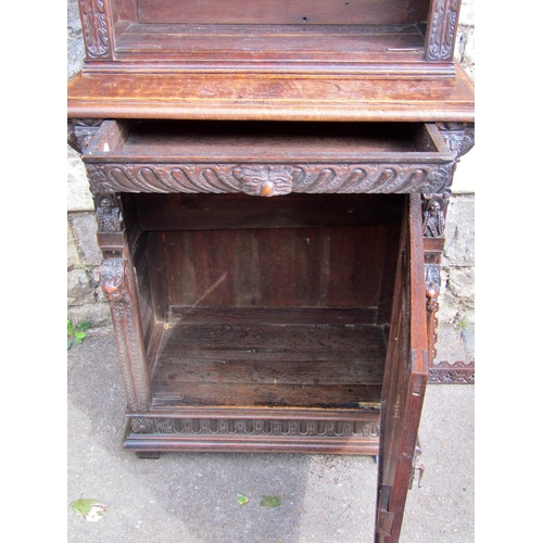 2207 - A mid 19th century continental pier cabinet the lower section enclosed by carved and panelled door w... 