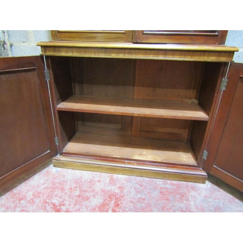 2456 - A Victorian mahogany library bookcase, the lower section enclosed by two arched and panelled doors, ... 