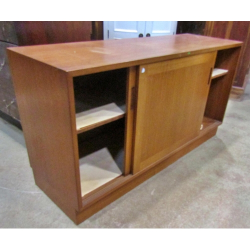 2253 - A mid century teak side cabinet enclosed by sliding two doors, 130 cm wide