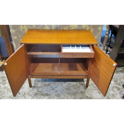 2256 - A mid century teak side cabinet enclosed by two panelled doors with cutlery tray within 90 cm wide