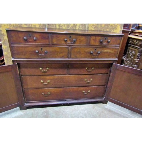 2266 - A Georgian mahogany secretaire, the front elevation enclosed by a pair of panelled doors enclosing t... 