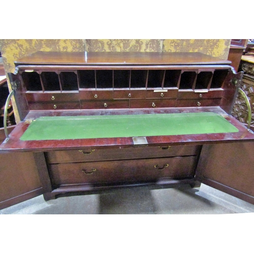 2266 - A Georgian mahogany secretaire, the front elevation enclosed by a pair of panelled doors enclosing t... 