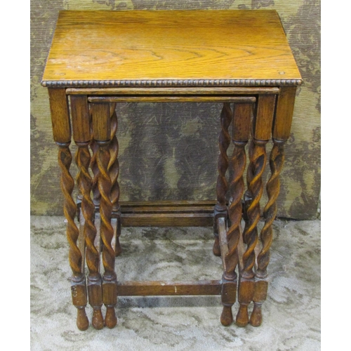 2269 - A mahogany stool with embossed hide upholstered seat, a nest of three graduated occasional tables in... 