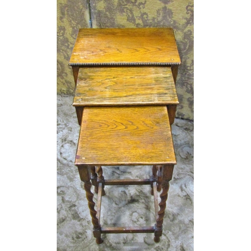 2269 - A mahogany stool with embossed hide upholstered seat, a nest of three graduated occasional tables in... 