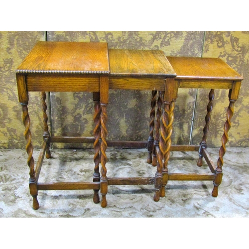 2269 - A mahogany stool with embossed hide upholstered seat, a nest of three graduated occasional tables in... 