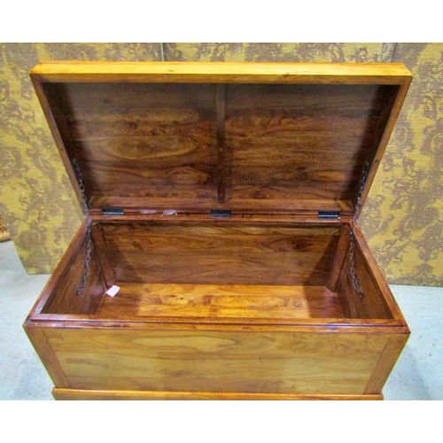 2273 - An Indian hardwood coffer of simple construction with overhanging top