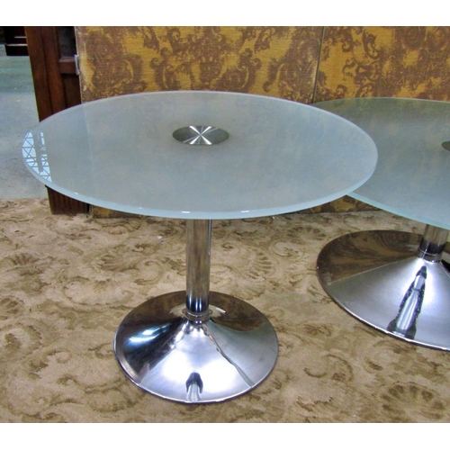 2275 - Two contemporary occasional tables the circular tops in tempered glass raised on turned columns and ... 