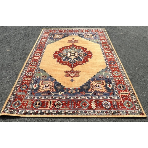 2713 - A Modern machine made rug of middle eastern design with central medallion in bright colours, 290cm x... 