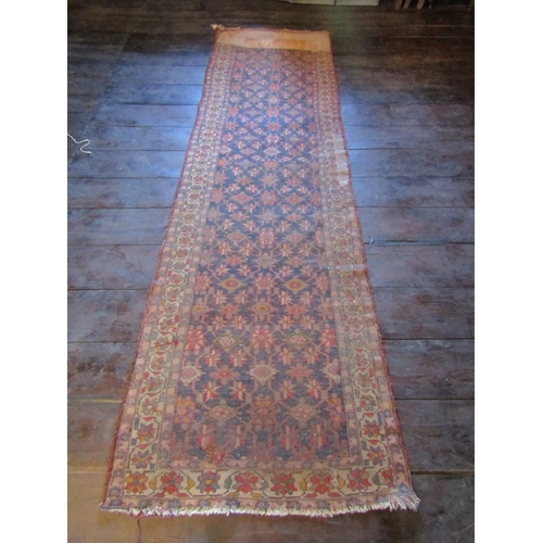 2723 - An old eastern carpet, the central field in ink blue with multi repeating abstract floral detail, wi... 