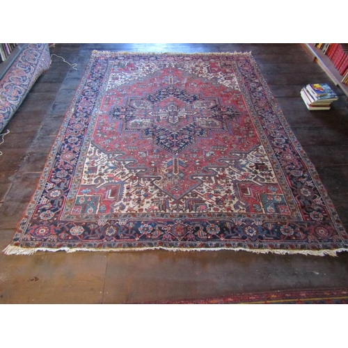 2735 - An old eastern wool carpet, the central lozenge shaped medallion upon a red field with abstract foli... 