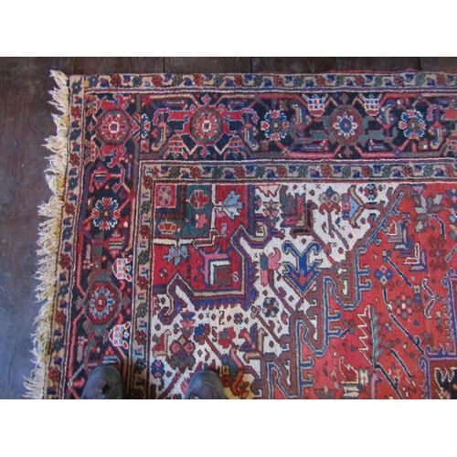 2735 - An old eastern wool carpet, the central lozenge shaped medallion upon a red field with abstract foli... 