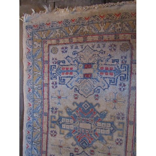 2728 - An eastern wool rug with beige ground, seven medallion centre within simple running borders, 280cm x... 