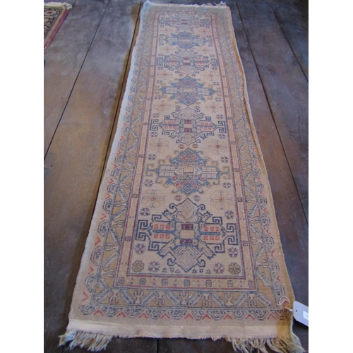 2728 - An eastern wool rug with beige ground, seven medallion centre within simple running borders, 280cm x... 