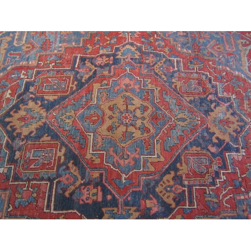 2734 - Good old Heriz wool carpet with lozenge shaped medallion, upon alternating blue and red ground panel... 