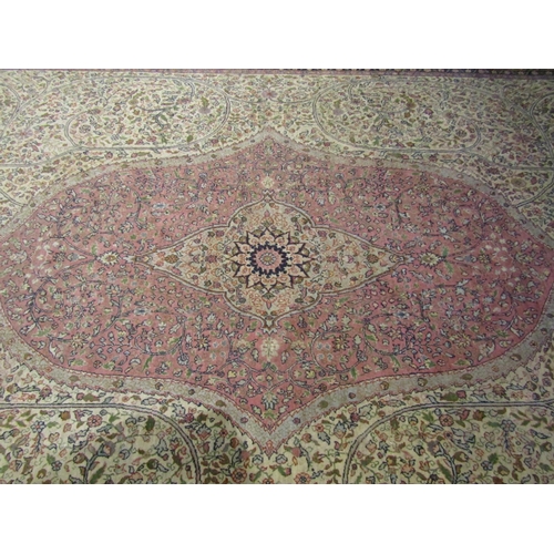 2730 - A Wilton carpet in the Persian manner, with central medallion, pink and white field, set within repe... 