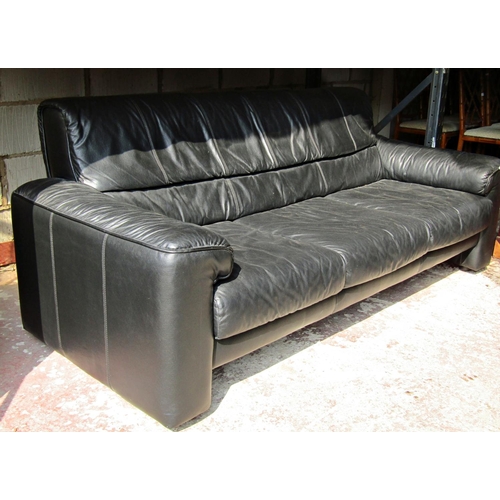 2485 - A three seat sofa and matching armchair with loose seat cushions, the sofa approximately 2 metres lo... 