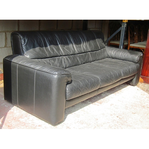 2485 - A three seat sofa and matching armchair with loose seat cushions, the sofa approximately 2 metres lo... 