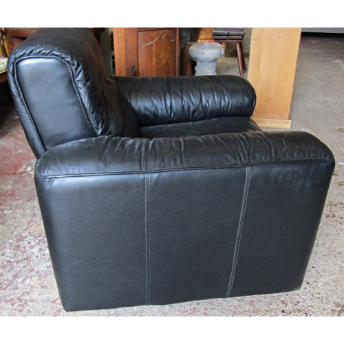 2485 - A three seat sofa and matching armchair with loose seat cushions, the sofa approximately 2 metres lo... 