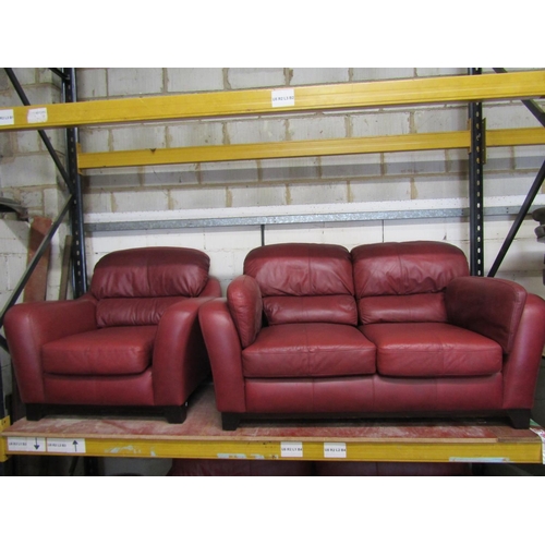 2505 - A Soflex two seat sofa and matching armchair in a red colourway together with a three seat sofa by S... 