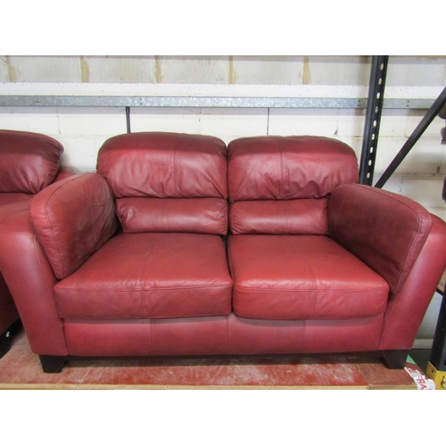 2505 - A Soflex two seat sofa and matching armchair in a red colourway together with a three seat sofa by S... 