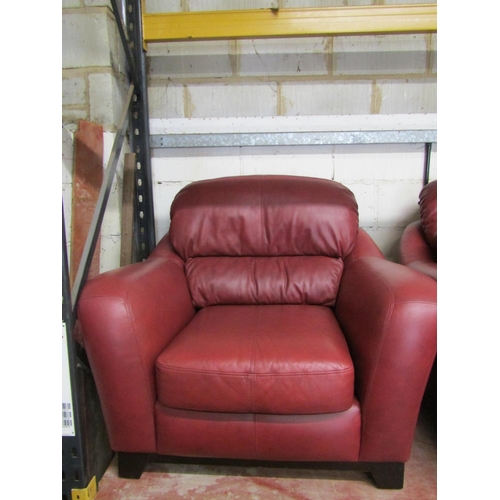 2505 - A Soflex two seat sofa and matching armchair in a red colourway together with a three seat sofa by S... 