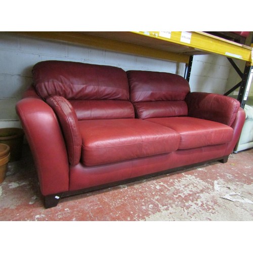 2505 - A Soflex two seat sofa and matching armchair in a red colourway together with a three seat sofa by S... 