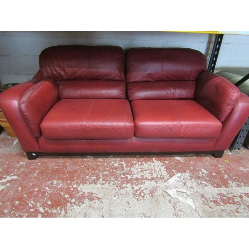 2505 - A Soflex two seat sofa and matching armchair in a red colourway together with a three seat sofa by S... 