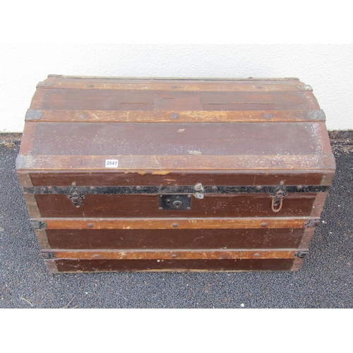 2513 - A vintage domed top and timber lathe bound chest with iron fittings, 83 cm wide x 38 cm deep x 53 cm... 