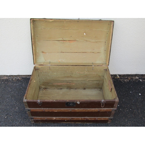 2513 - A vintage domed top and timber lathe bound chest with iron fittings, 83 cm wide x 38 cm deep x 53 cm... 