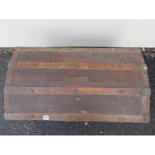 2513 - A vintage domed top and timber lathe bound chest with iron fittings, 83 cm wide x 38 cm deep x 53 cm... 