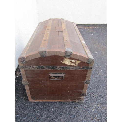 2513 - A vintage domed top and timber lathe bound chest with iron fittings, 83 cm wide x 38 cm deep x 53 cm... 