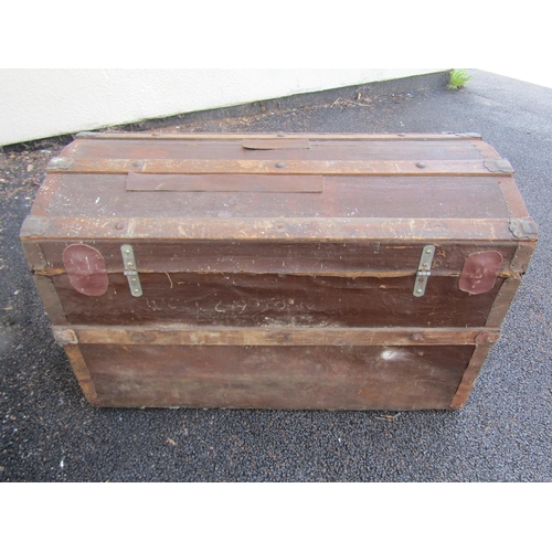 2513 - A vintage domed top and timber lathe bound chest with iron fittings, 83 cm wide x 38 cm deep x 53 cm... 