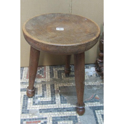 2259 - An oak stool with slatted top on turned supports, a further stool with dished top on tripod base