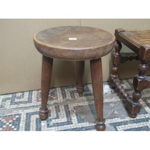 2259 - An oak stool with slatted top on turned supports, a further stool with dished top on tripod base