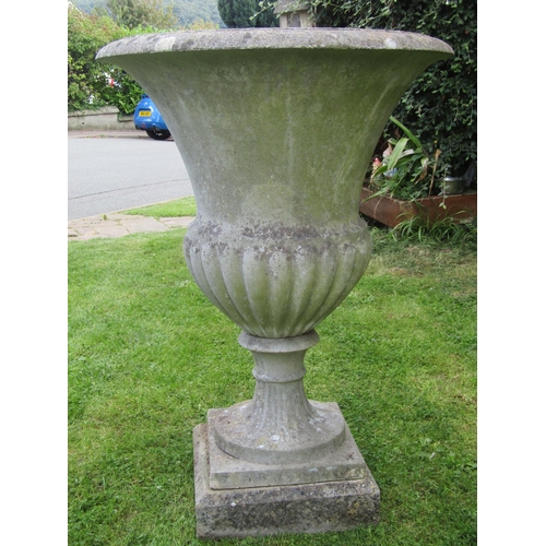 2083 - A pair of good quality weathered cast composition stone Campana shaped garden urns with flared rims ... 