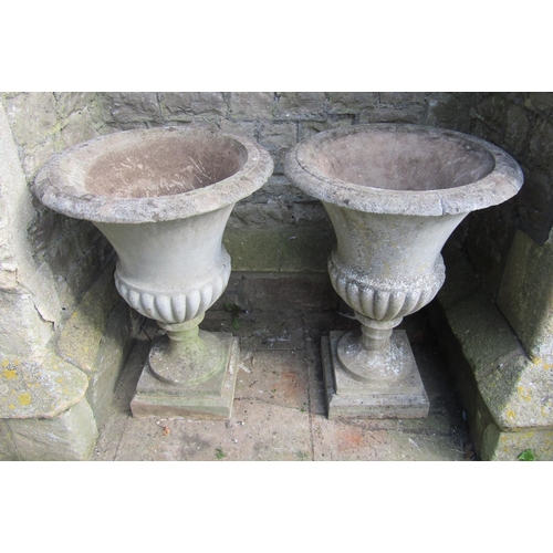 2084 - A pair of good quality weathered cast composition stone Campana shaped garden urns with flared rims ... 