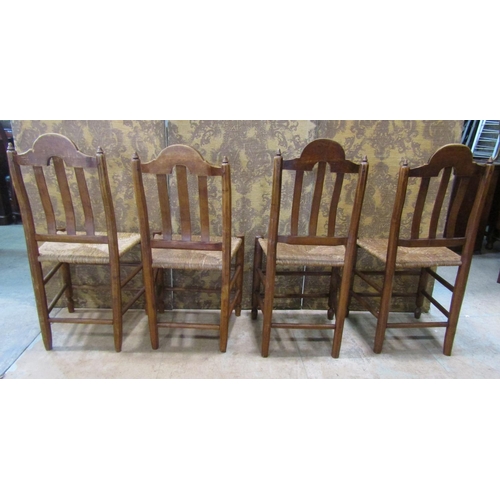 2187 - A set of four 19th century French provincial mixed wood dining chairs with rush seats, open slatted ... 