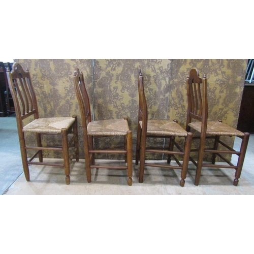 2187 - A set of four 19th century French provincial mixed wood dining chairs with rush seats, open slatted ... 