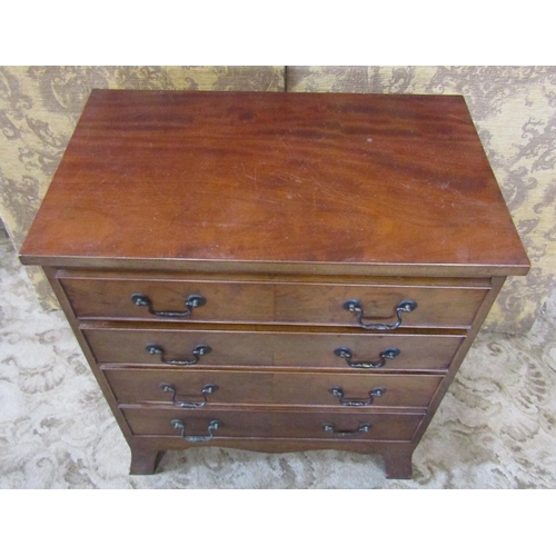 2193 - A small good quality Georgian style mahogany chest of four long graduated drawers with shaped apron ... 