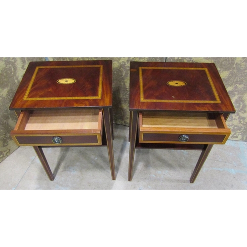 2195 - A pair of reproduction two tier lamp tables with inlaid detail,  each enclosed by a frieze drawer ra... 