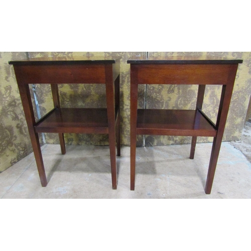 2195 - A pair of reproduction two tier lamp tables with inlaid detail,  each enclosed by a frieze drawer ra... 