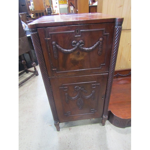 2209 - A Regency mahogany pedestal sideboard with carved and applied ribbon and garland decoration includin... 