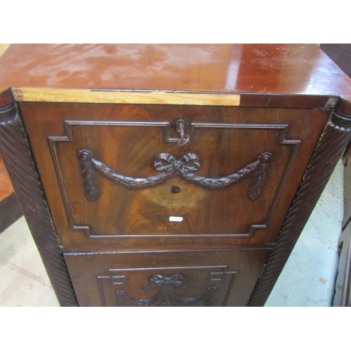 2209 - A Regency mahogany pedestal sideboard with carved and applied ribbon and garland decoration includin... 