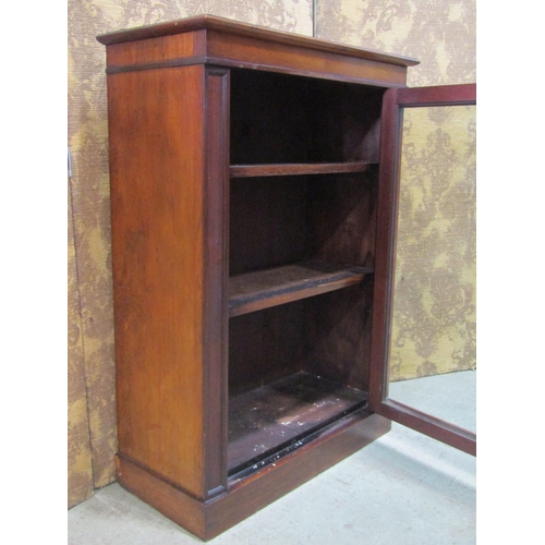 2213 - A small Victorian rosewood side cupboard with glazed panelled door 62 cm wide