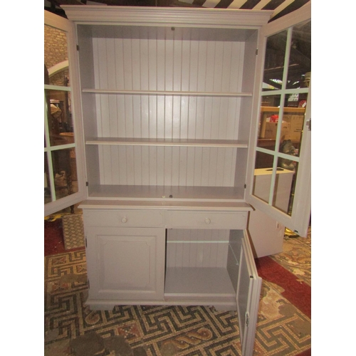 2219 - A Georgian style cabinet the lower section enclosed by two panelled doors and two frieze drawers, th... 