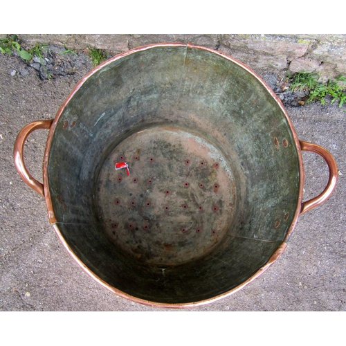 2222 - A 19th century copper tub of cylindrical tapering form with loop handles, 46 cm wide