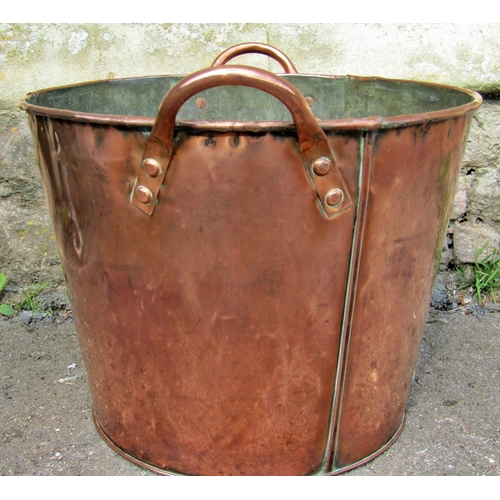 2222 - A 19th century copper tub of cylindrical tapering form with loop handles, 46 cm wide