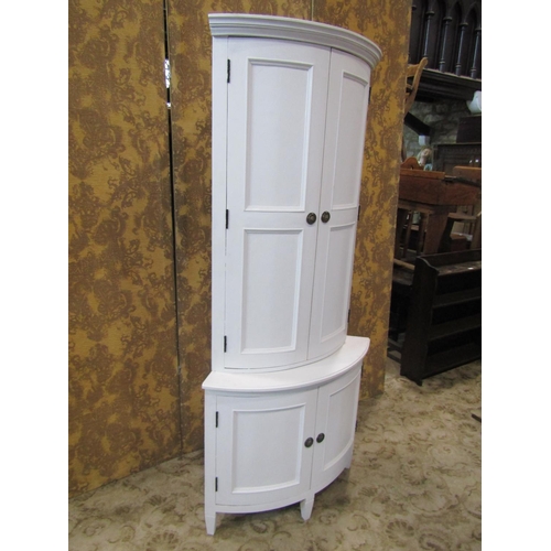 2225 - Bow fronted freestanding corner cupboard to a Scandinavian design enclosed by two pairs of panelled ... 